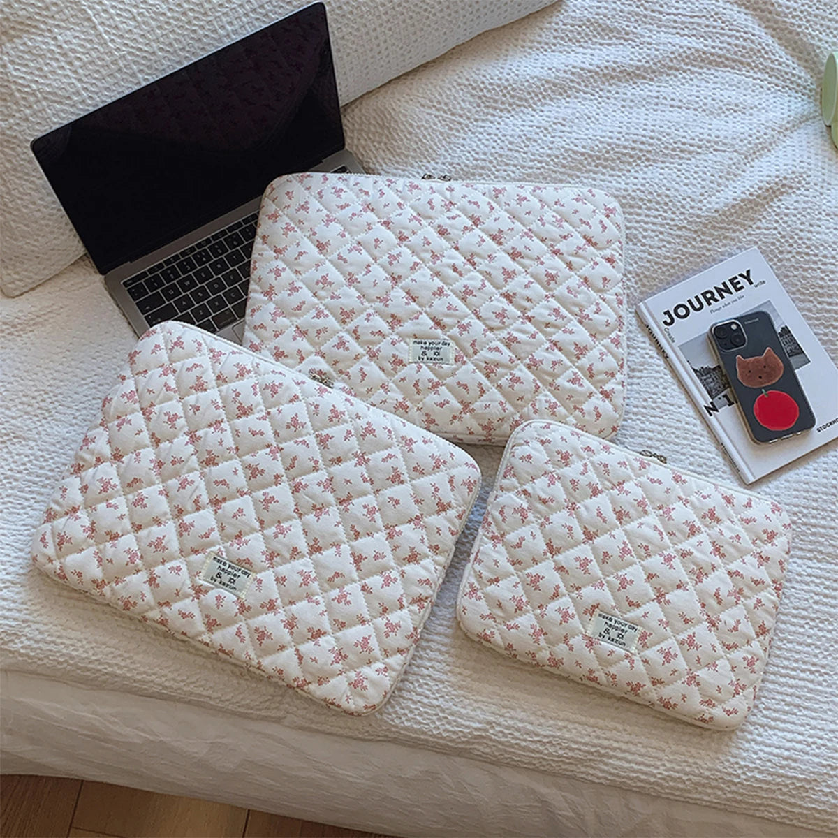 Gesteppte Laptoptasche mit Blumendruck